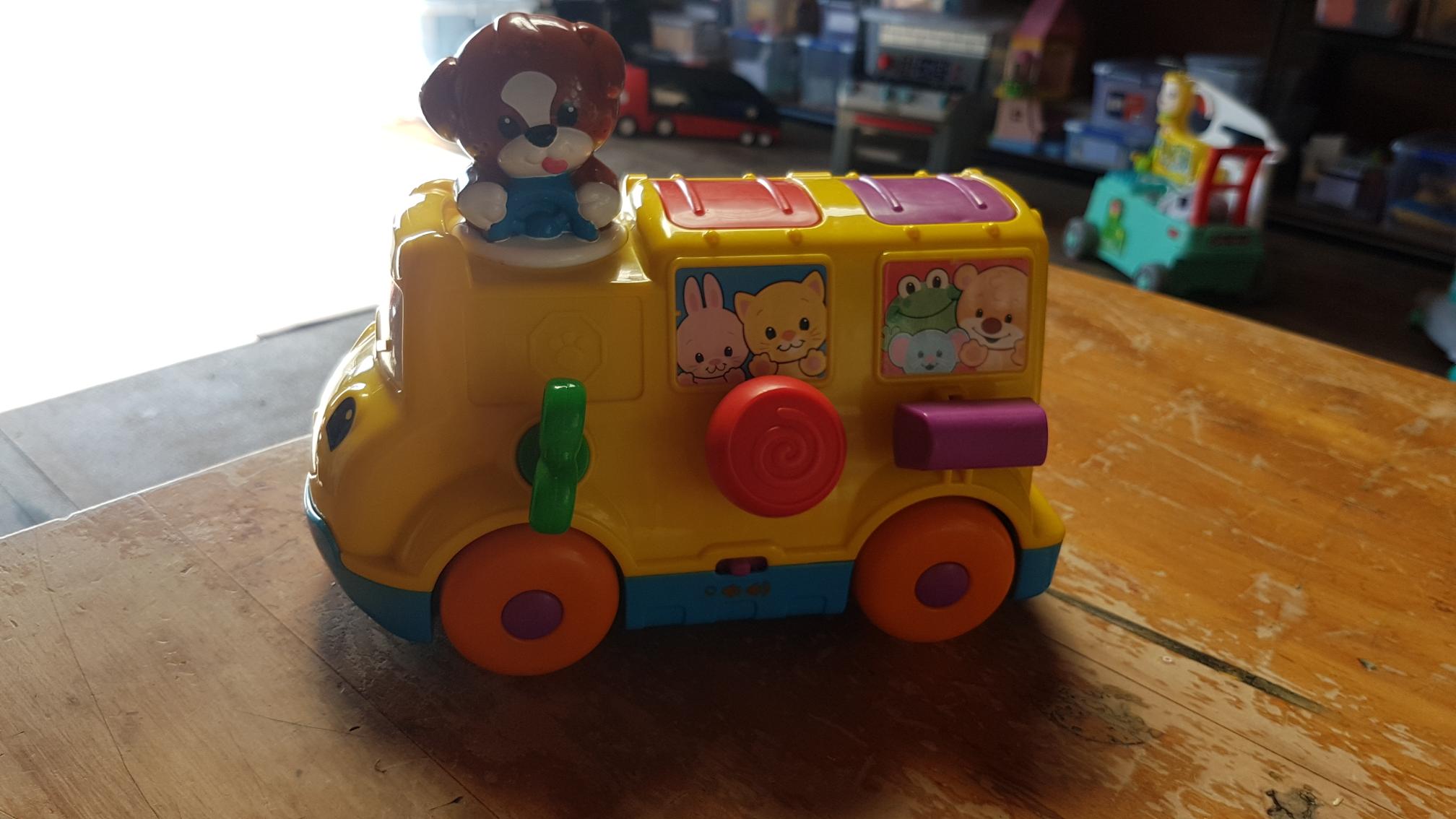 Fisher price musical pop best sale up bus