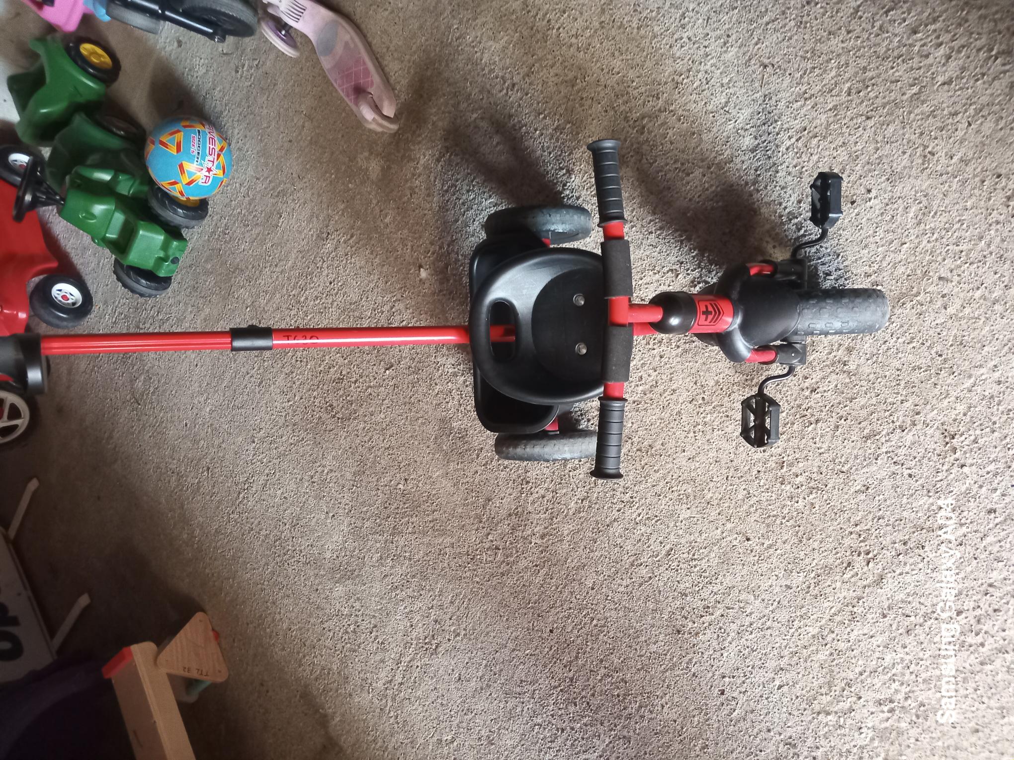 Red trike with handle